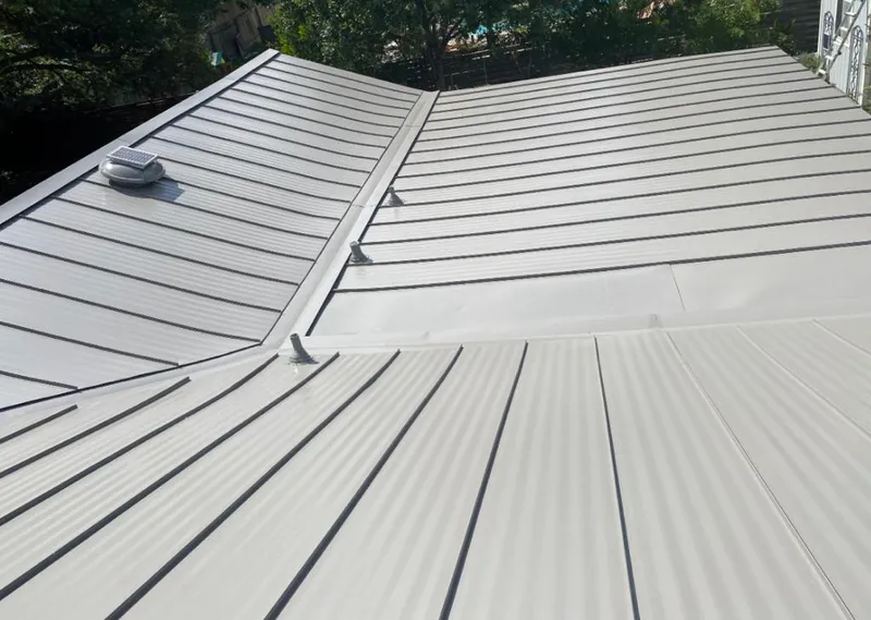 Solar attic fan installed on a metal roof for Roof Ventilation in Pinellas Park